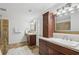 This bathroom features a double vanity and a tiled shower with a glass door at 230 Summerhouse Ln, Atlanta, GA 30350