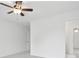 Neutral bedroom with a ceiling fan and light coming through the doorway at 230 Summerhouse Ln, Atlanta, GA 30350