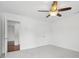 Empty bedroom with light gray carpet and a ceiling fan at 230 Summerhouse Ln, Atlanta, GA 30350