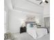 Bright bedroom with neutral colors, tray ceiling, bedside tables, and decorative wall art at 230 Summerhouse Ln, Atlanta, GA 30350
