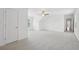 Large bedroom with neutral carpet, a ceiling fan, and a door to a hallway at 230 Summerhouse Ln, Atlanta, GA 30350