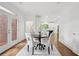 Cozy dining area with a round table and access to the outdoors, ideal for casual dining and entertaining at 230 Summerhouse Ln, Atlanta, GA 30350