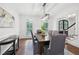Formal dining room featuring modern lighting, hardwood floors, and neutral decor at 230 Summerhouse Ln, Atlanta, GA 30350