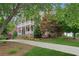 Brick home with a long driveway and a welcoming front porch at 230 Summerhouse Ln, Atlanta, GA 30350
