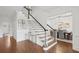 Bright foyer with staircase and doorway to the dining room at 230 Summerhouse Ln, Atlanta, GA 30350