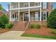 Inviting brick staircase leading to the front door, framed by mature landscaping at 230 Summerhouse Ln, Atlanta, GA 30350