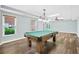 Game room featuring modern ceiling lights, luxury vinyl plank flooring, and a pool table at 230 Summerhouse Ln, Atlanta, GA 30350