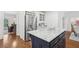 Spacious kitchen boasts a center island, granite countertops, stainless appliances and ample storage at 230 Summerhouse Ln, Atlanta, GA 30350