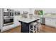 Modern kitchen with stainless steel appliances, large island, and custom cabinetry, offering both style and function at 230 Summerhouse Ln, Atlanta, GA 30350