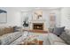 Cozy living room with fireplace and comfortable seating arrangement at 230 Summerhouse Ln, Atlanta, GA 30350