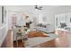 Bright living room with a fireplace, hardwood floors, and stylish decor, perfect for entertaining at 230 Summerhouse Ln, Atlanta, GA 30350