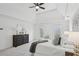 Bright main bedroom with a tray ceiling, a cozy chair, and plenty of natural light, offering a relaxing atmosphere at 230 Summerhouse Ln, Atlanta, GA 30350