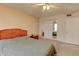 This cozy bedroom features wallpaper, a ceiling fan, closet doors and a wood headboard at 3252 Abbeywood Dr, Decatur, GA 30034