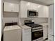 Well-lit kitchen with stainless steel appliances, granite countertops, and white subway tile backsplash at 3252 Abbeywood Dr, Decatur, GA 30034
