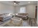 Sunlit living room featuring hardwood floors, neutral paint, and comfortable seating at 3252 Abbeywood Dr, Decatur, GA 30034