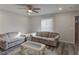 Comfortable living room with hardwood floors, soft neutral colors, and a large ceiling fan at 3252 Abbeywood Dr, Decatur, GA 30034