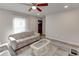 Bright living room with neutral walls, wood-look floors, ceiling fan, and large window at 3252 Abbeywood Dr, Decatur, GA 30034