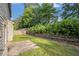 Picturesque backyard featuring mature trees and lush green lawn, perfect for outdoor enjoyment at 4889 Arbor View Nw Pkwy, Acworth, GA 30101