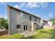 A fenced backyard featuring a patio and a well-maintained lawn, offering outdoor space at 4889 Arbor View Nw Pkwy, Acworth, GA 30101