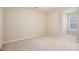 Bright bedroom with neutral carpet and a window at 4889 Arbor View Nw Pkwy, Acworth, GA 30101