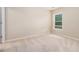 Cozy bedroom featuring carpeted floors and a large window providing natural light at 4889 Arbor View Nw Pkwy, Acworth, GA 30101
