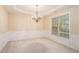 Bright dining room with chair-rail detail, neutral paint and carpet at 4889 Arbor View Nw Pkwy, Acworth, GA 30101