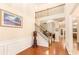 Grand foyer with hardwood floors, wainscoting, and a staircase leading to the second floor at 4889 Arbor View Nw Pkwy, Acworth, GA 30101