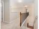 Carpeted hallway featuring a wood railing at 4889 Arbor View Nw Pkwy, Acworth, GA 30101