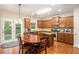 Eat-in kitchen with hardwood floors, granite countertops and island at 4889 Arbor View Nw Pkwy, Acworth, GA 30101