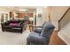Cozy living room featuring a seamless transition to the kitchen and dining area at 4889 Arbor View Nw Pkwy, Acworth, GA 30101