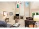 Bright living room featuring a fireplace, large windows, and a high ceiling at 4889 Arbor View Nw Pkwy, Acworth, GA 30101