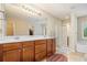 Bright bathroom featuring double sinks, a walk-in shower, and a soaking tub at 4889 Arbor View Nw Pkwy, Acworth, GA 30101