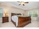 Spacious main bedroom with tray ceiling, fan, and en-suite bath at 4889 Arbor View Nw Pkwy, Acworth, GA 30101