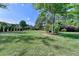 Expansive backyard features lush greenery, mature trees, manicured landscaping and a well-maintained lawn at 9440 Knollcrest Blvd, Alpharetta, GA 30022