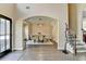 Open-concept view from the foyer to the dining room, featuring hardwood floors and an elegant chandelier at 9440 Knollcrest Blvd, Alpharetta, GA 30022