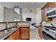 Open concept kitchen with modern appliances, granite countertops, and seamless flow to living area at 9440 Knollcrest Blvd, Alpharetta, GA 30022