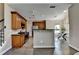 Well-equipped kitchen features modern appliances, wooden cabinets, a breakfast bar, and hardwood floors at 9440 Knollcrest Blvd, Alpharetta, GA 30022