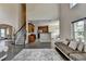 Open-concept view of the living room, dining room, and kitchen featuring hardwood floors at 9440 Knollcrest Blvd, Alpharetta, GA 30022
