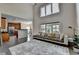 Spacious living room featuring high ceilings, lots of natural light and flowing access to the kitchen at 9440 Knollcrest Blvd, Alpharetta, GA 30022