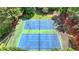 Aerial view of the neighborhood tennis courts, a recreational amenity for residents at 9440 Knollcrest Blvd, Alpharetta, GA 30022