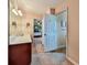 An ensuite bathroom features a tile floor and is accessible from the primary bedroom at 176 Oakland Way, Dallas, GA 30157