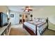 Well-lit bedroom with a ceiling fan, a window, and a well-made bed set at 176 Oakland Way, Dallas, GA 30157