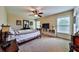 Large bedroom with a ceiling fan and a window, along with a TV on an entertainment stand at 176 Oakland Way, Dallas, GA 30157