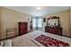 Cozy bedroom featuring carpeted floors and traditional-style furniture set against neutral-colored walls at 176 Oakland Way, Dallas, GA 30157