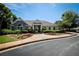 Community clubhouse featuring manicured landscaping and inviting entryway, perfect for resident gatherings and events at 176 Oakland Way, Dallas, GA 30157