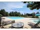 Expansive community pool area with lounge chairs and umbrellas, providing a resort-like atmosphere for residents at 176 Oakland Way, Dallas, GA 30157