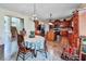 Cozy dining area with chandelier lighting and hardwood floors leads into the kitchen area at 176 Oakland Way, Dallas, GA 30157