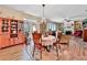 Inviting dining area featuring hardwood floors, a chandelier, and seamless access to the living room and outdoor spaces at 176 Oakland Way, Dallas, GA 30157