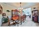 Elegant dining room with wood table, china cabinet, and carpeted floor at 176 Oakland Way, Dallas, GA 30157
