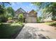Beautiful two-story home with a well-manicured lawn and a large driveway at 176 Oakland Way, Dallas, GA 30157